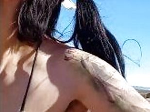 Perverted Tattooed Spanish milf in bike and tiger bikini shows tits on street